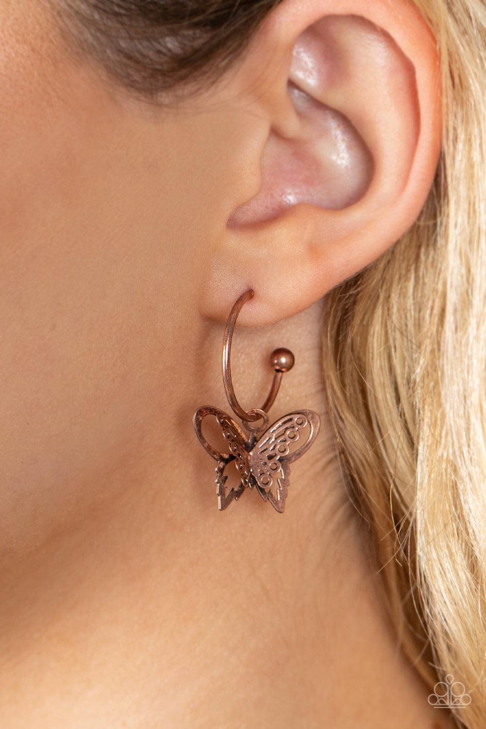 Butterfly Freestyle Copper Hoop Earrings - Paparazzi Accessories- on model - CarasShop.com - Paparazzi Jewelry by Cara Jewels
