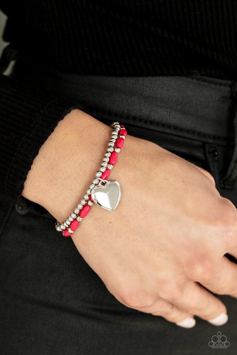 Candy Gram Pink and Silver Heart Charm Bracelet - Paparazzi Accessories- on model - CarasShop.com - Paparazzi Jewelry by Cara Jewels