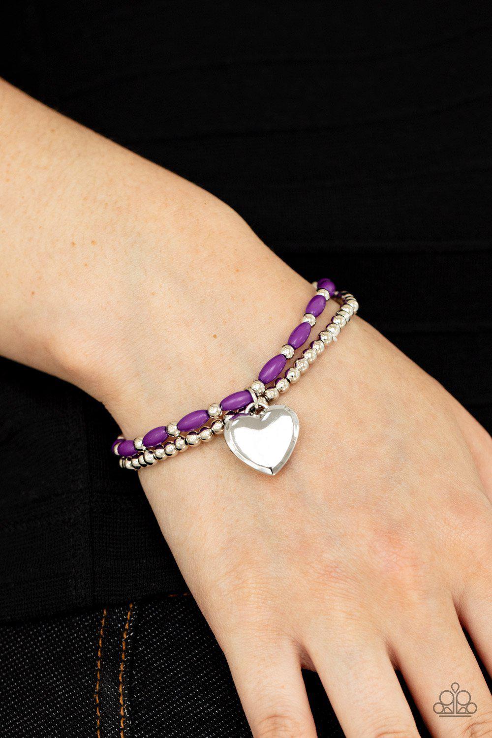 Candy Gram Purple and Silver Heart Charm Bracelet - Paparazzi Accessories- on model - CarasShop.com - Paparazzi Jewelry by Cara Jewels