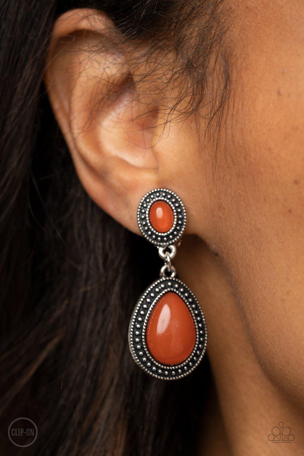 Carefree Clairvoyance Orange Opal Clip-On Earrings - Paparazzi Accessories- on model - CarasShop.com - Paparazzi Jewelry by Cara Jewels