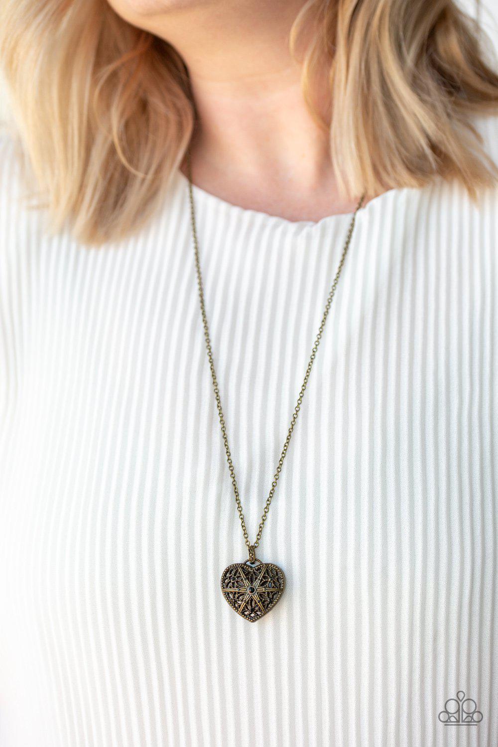 Casanova Charm Black Rhinestone and Brass Heart Necklace - Paparazzi Accessories- on model - CarasShop.com - Paparazzi Jewelry by Cara Jewels