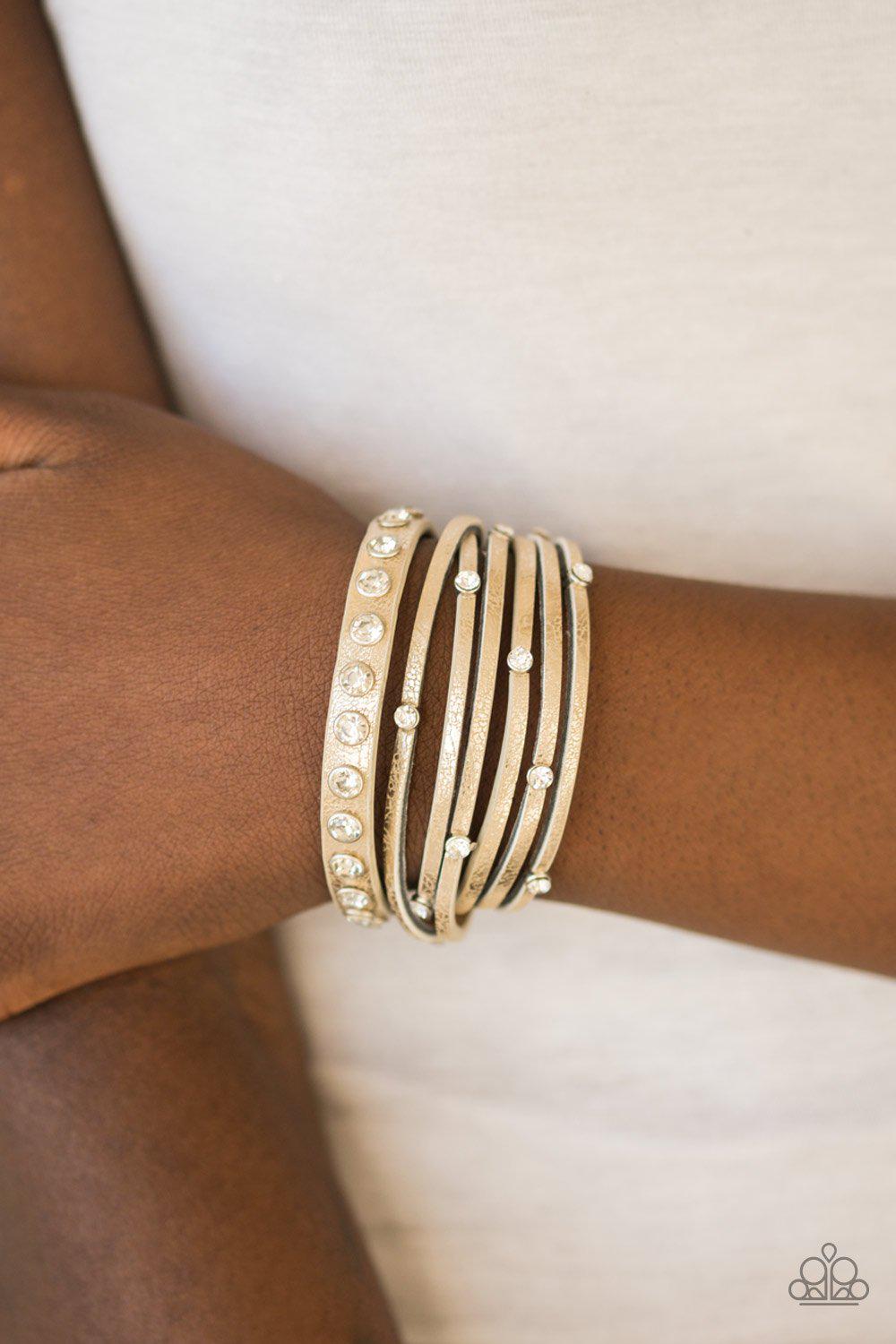 CATWALK It Off Gold Urban Wrap Snap Bracelet - Paparazzi Accessories- on model - CarasShop.com - Paparazzi Jewelry by Cara Jewels