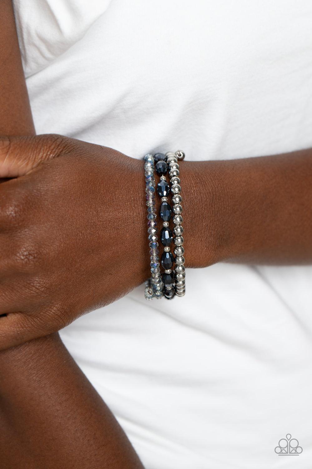 Celestial Chapter Blue Coil Bracelet - Paparazzi Accessories- on model - CarasShop.com - Paparazzi Jewelry by Cara Jewels