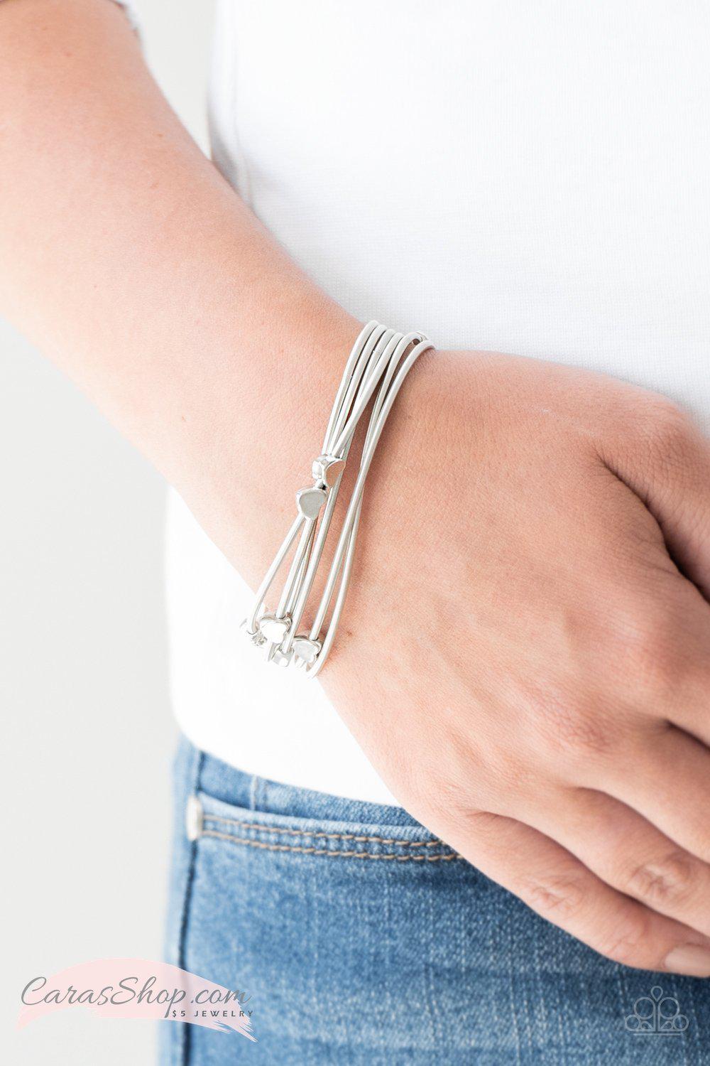 Charmingly Cupid Silver Heart Stretch Bracelet Set - Paparazzi Accessories- on model - CarasShop.com - Paparazzi Jewelry by Cara Jewels