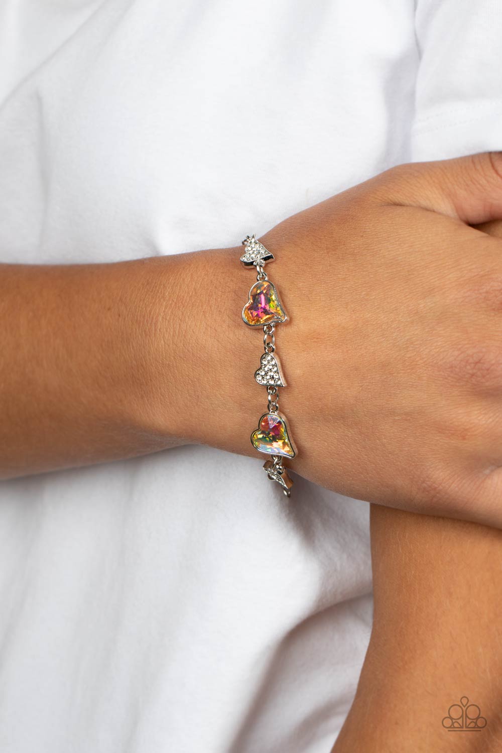 Cluelessly Crushing Multi Iridescent Rhinestone Heart Bracelet - Paparazzi Accessories- on model - CarasShop.com - Paparazzi Jewelry by Cara Jewels
