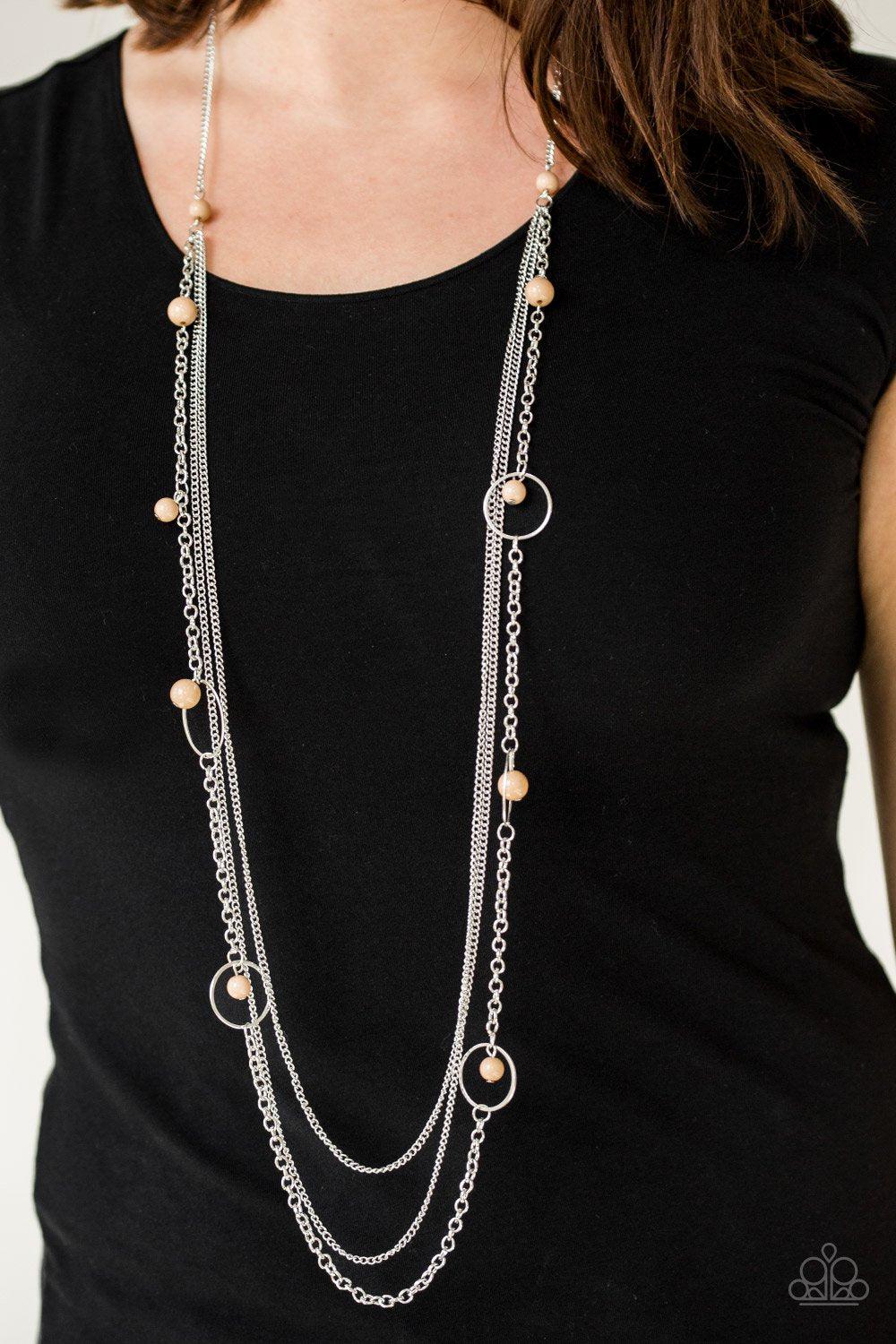 Collectively Carefree Brown and Silver Necklace - Paparazzi Accessories- on model - CarasShop.com - Paparazzi Jewelry by Cara Jewels