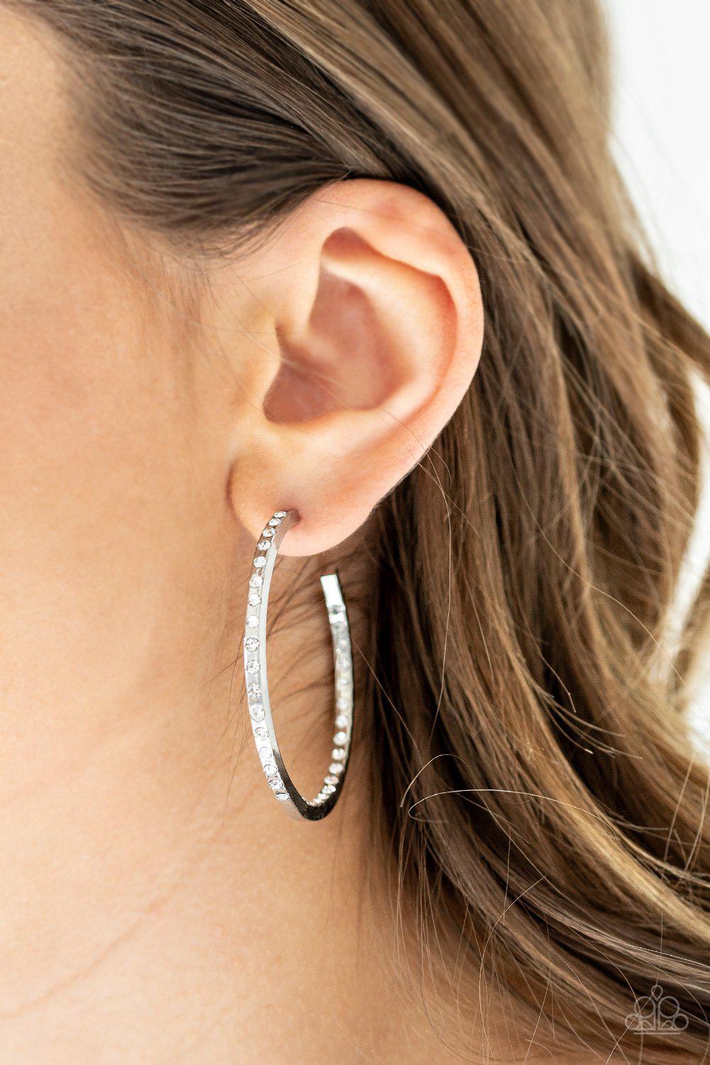 Coming Into Money Silver and White Rhinestone Hoop Earrings - Paparazzi Accessories- on model - CarasShop.com - Paparazzi Jewelry by Cara Jewels