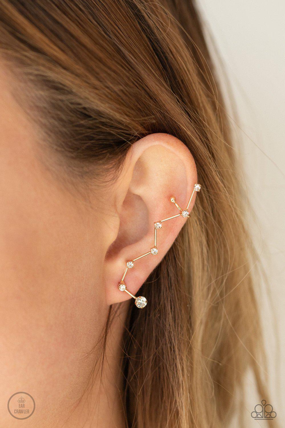 CONSTELLATION Prize Gold and White Rhinestone Ear Crawler Earrings - Paparazzi Accessories- on model - CarasShop.com - Paparazzi Jewelry by Cara Jewels