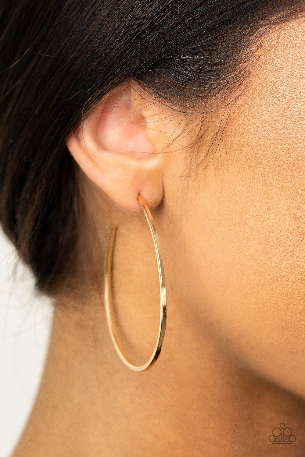 Cool Curves Gold Hoop Earrings - Paparazzi Accessories- on model - CarasShop.com - Paparazzi Jewelry by Cara Jewels