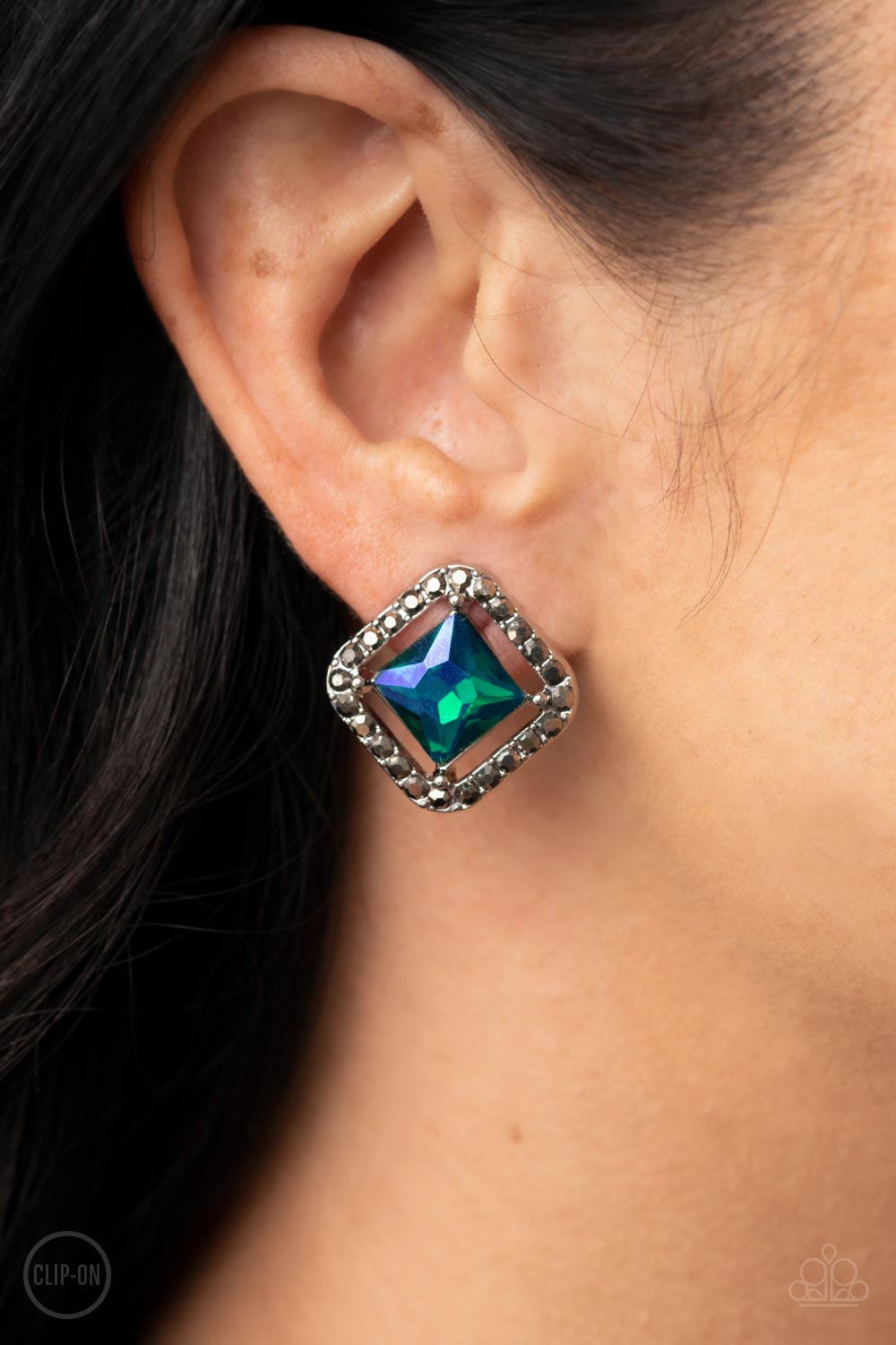 Cosmic Catwalk Green Clip-On Earrings - Paparazzi Accessories- on model - CarasShop.com - Paparazzi Jewelry by Cara Jewels