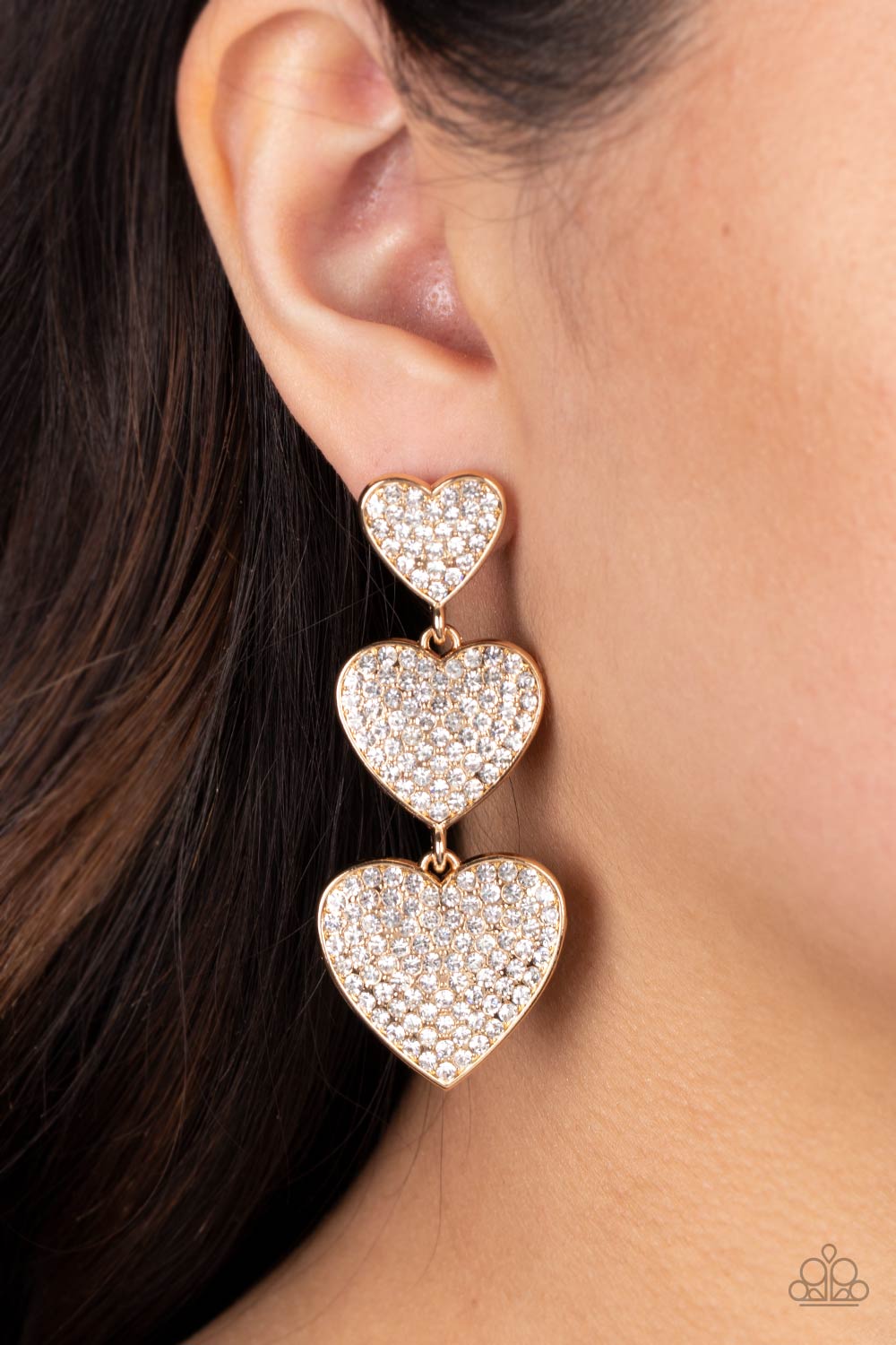 Couples Retreat Gold & White Rhinestone Heart Earrings - Paparazzi Accessories- on model - CarasShop.com - Paparazzi Jewelry by Cara Jewels