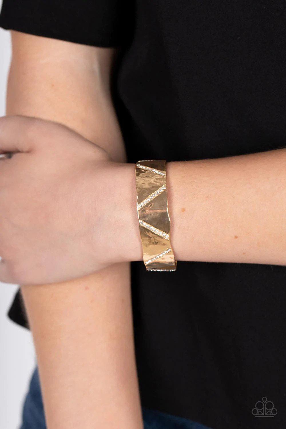 Couture Crusher Gold Cuff Bracelet - Paparazzi Accessories- on model - CarasShop.com - Paparazzi Jewelry by Cara Jewels