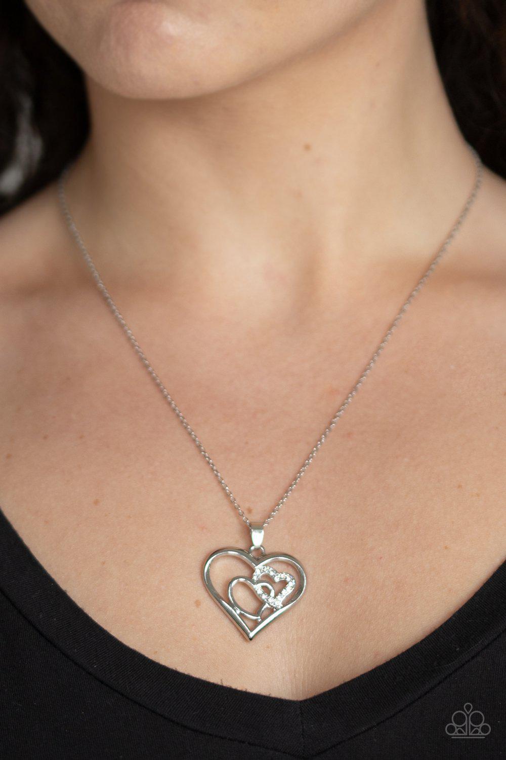 Cupid Charm White Rhinestone Heart Necklace - Paparazzi Accessories- on model - CarasShop.com - Paparazzi Jewelry by Cara Jewels