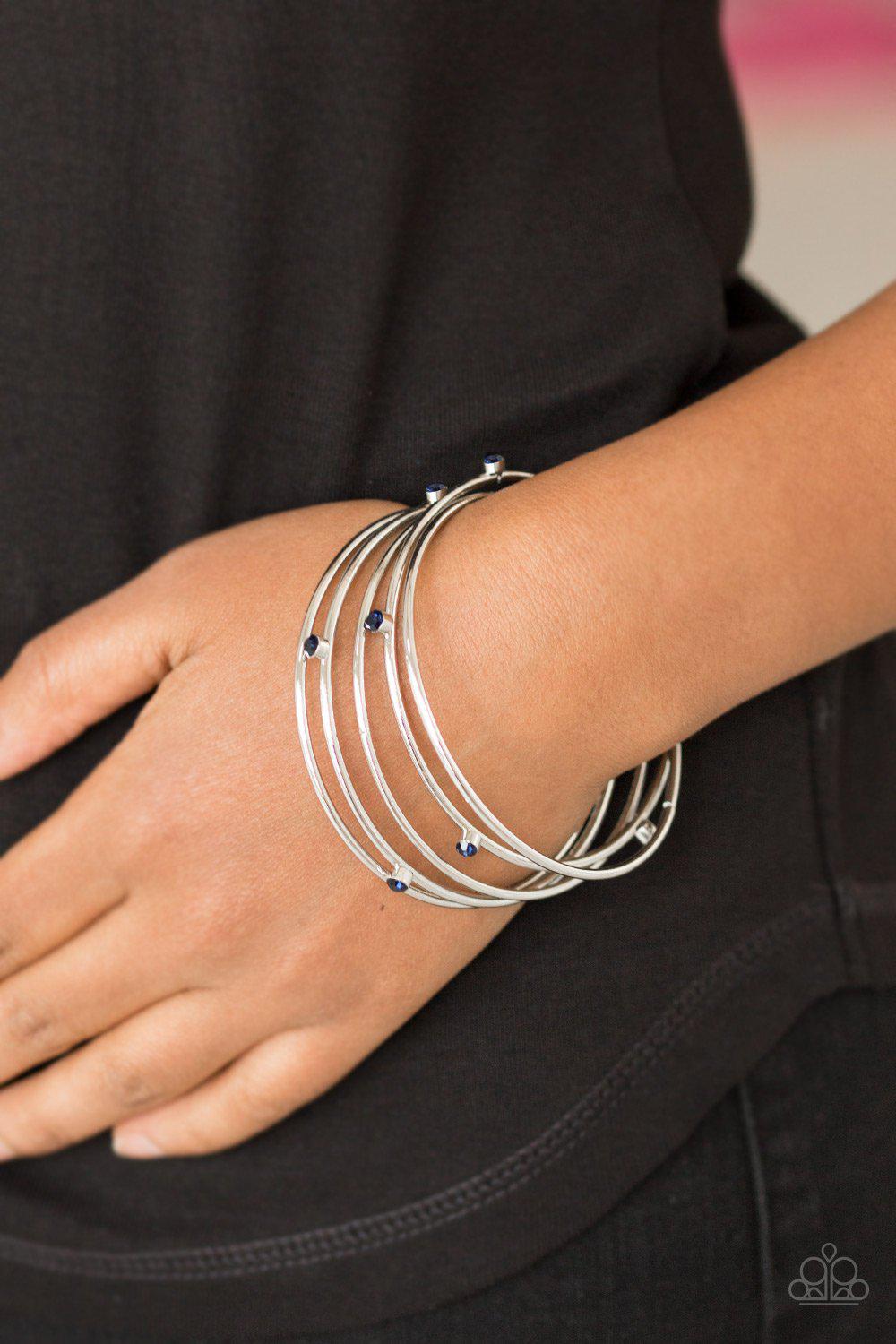 Delicate Decadence Blue and Silver Bangle Bracelet Set - Paparazzi Accessories- on model - CarasShop.com - Paparazzi Jewelry by Cara Jewels