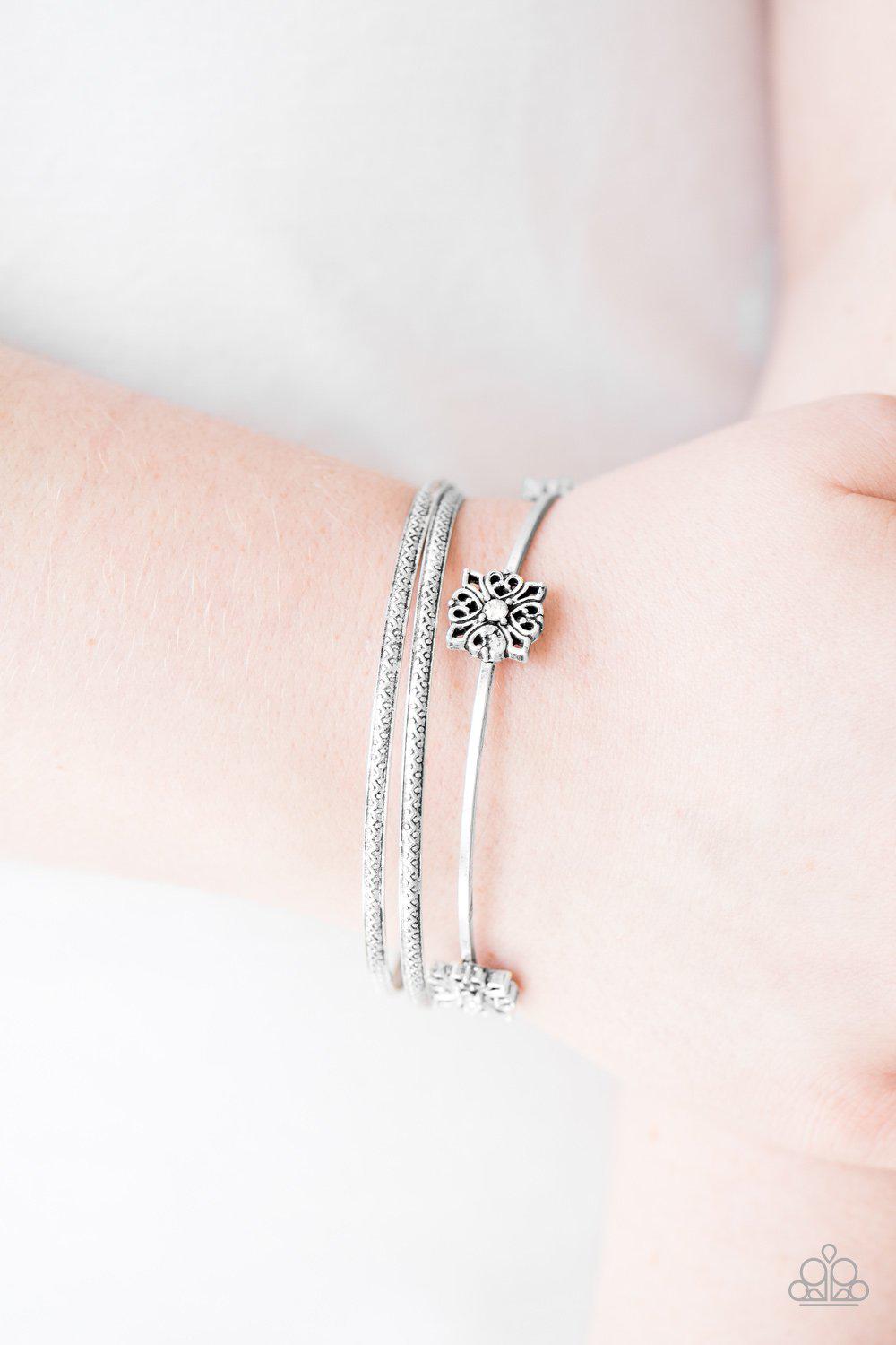 Demure Decor White Rhinestone and Silver Bangle Bracelet Set - Paparazzi Accessories- on model - CarasShop.com - Paparazzi Jewelry by Cara Jewels