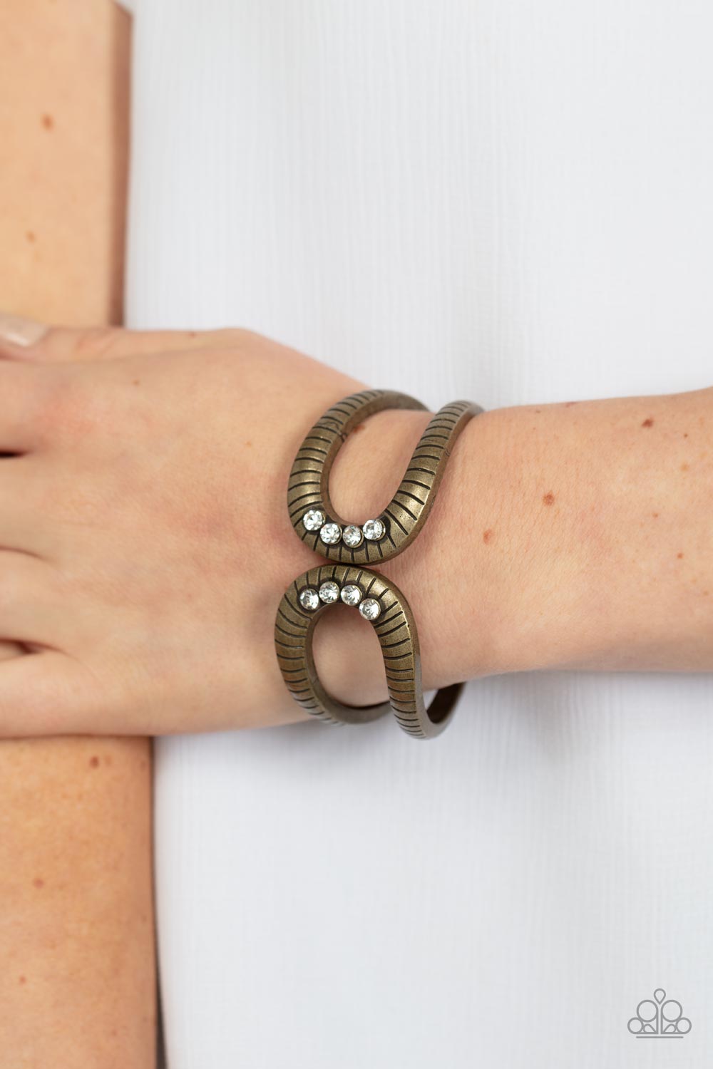 Desert Prosperity Brass & White Rhinestone Bracelet - Paparazzi Accessories- on model - CarasShop.com - Paparazzi Jewelry by Cara Jewels