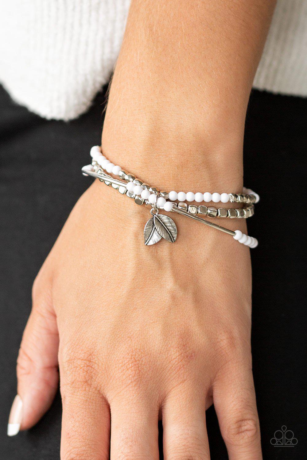 Desert Wanderer White and Silver Leaf Charm Bracelet - Paparazzi Accessories- on model - CarasShop.com - Paparazzi Jewelry by Cara Jewels