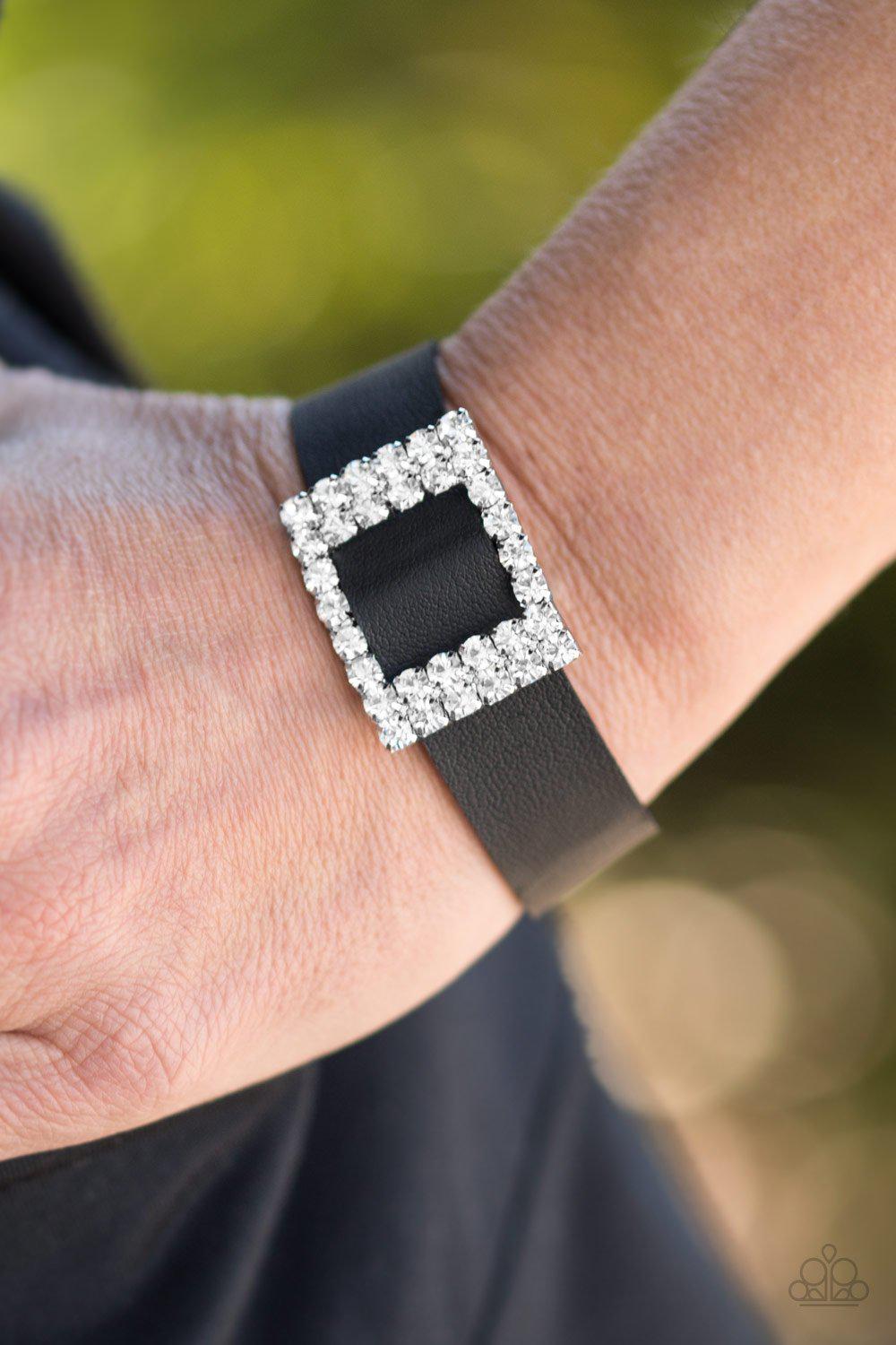 Diamond Diva Black Leather and White Rhinestone Wrap Snap Bracelet - Paparazzi Accessories- on model - CarasShop.com - Paparazzi Jewelry by Cara Jewels