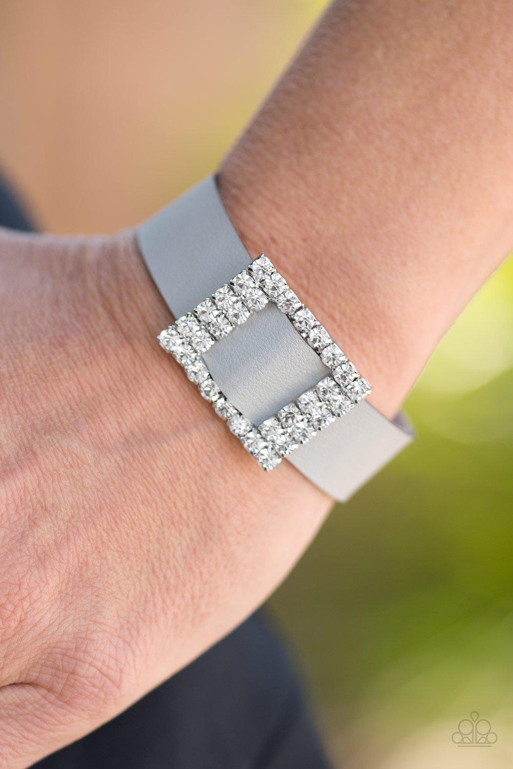 Diamond Diva Silver Leather and White Rhinestone Wrap Snap Bracelet - Paparazzi Accessories- on model - CarasShop.com - Paparazzi Jewelry by Cara Jewels