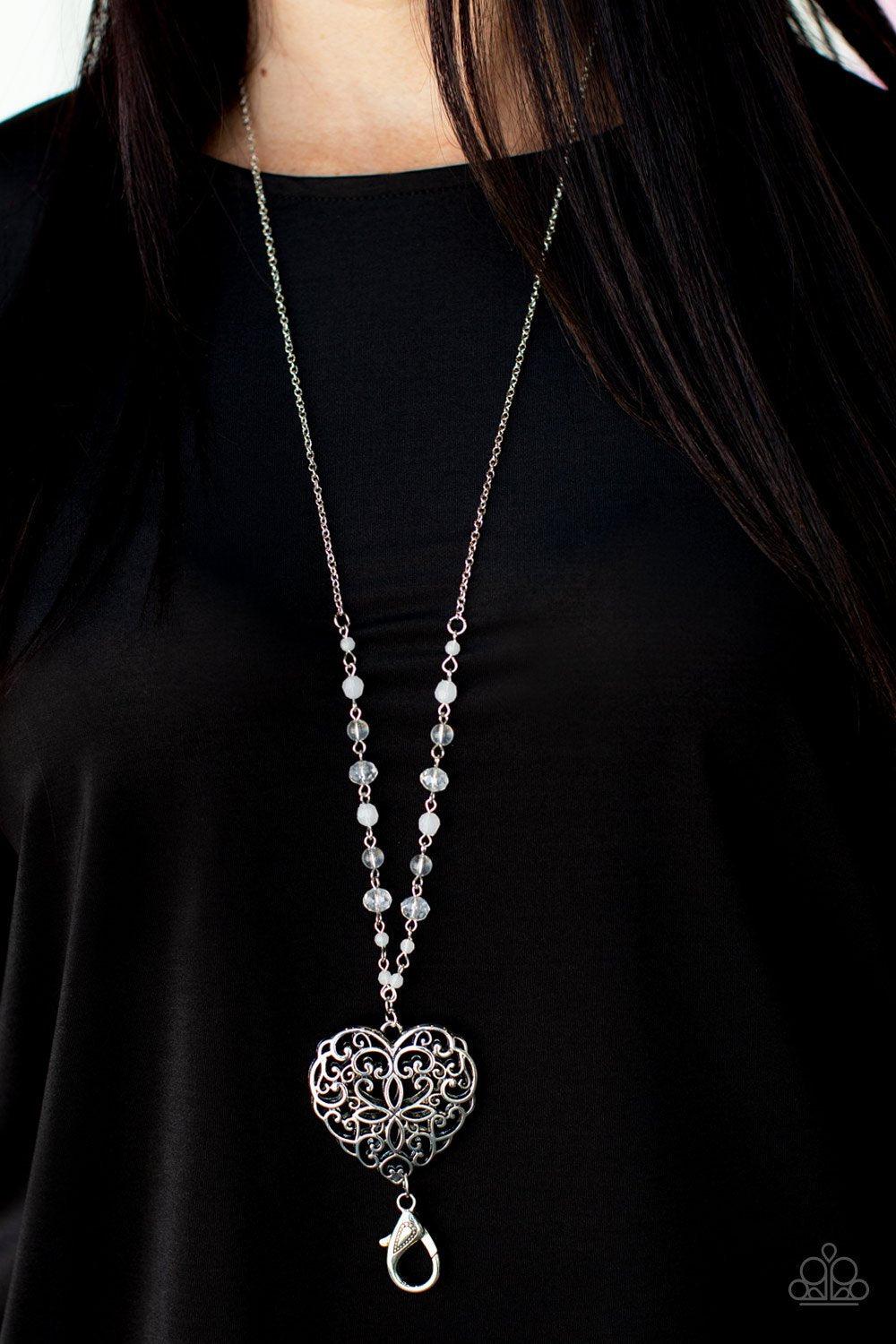 Doting Devotion White and Silver Filigree Heart Lanyard Necklace - Paparazzi Accessories- on model - CarasShop.com - Paparazzi Jewelry by Cara Jewels