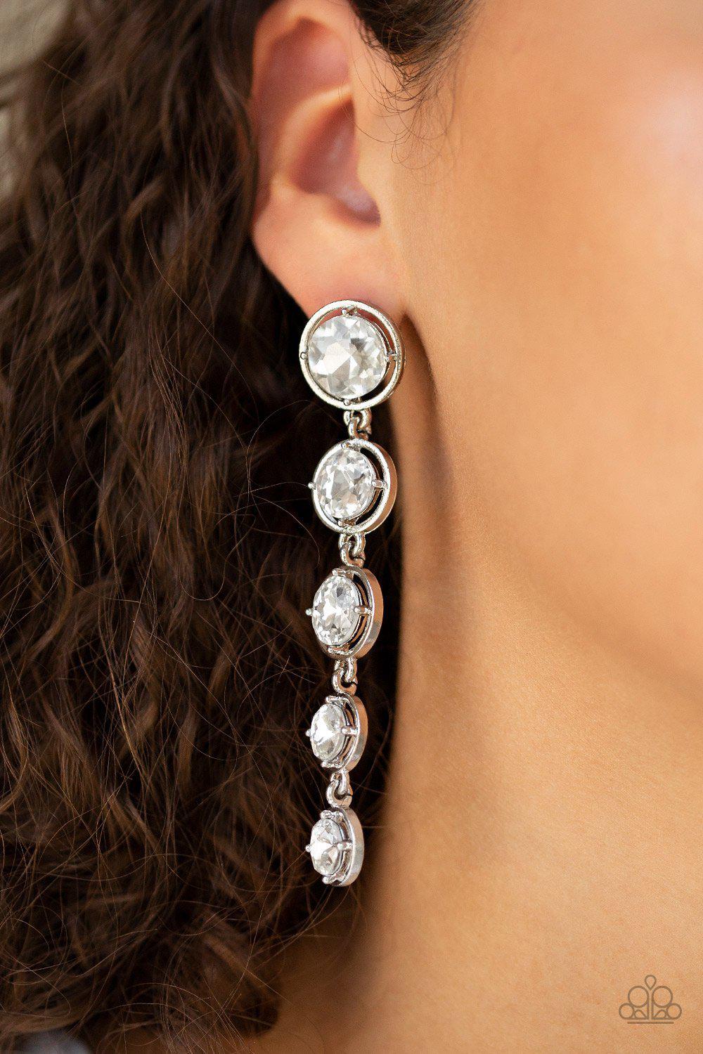 Drippin In Starlight White Rhinestone Earrings - Paparazzi Accessories- on model - CarasShop.com - Paparazzi Jewelry by Cara Jewels