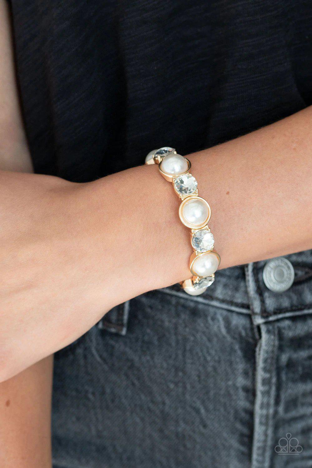 Elegant Entertainment Gold Bracelet - Paparazzi Accessories- on model - CarasShop.com - Paparazzi Jewelry by Cara Jewels