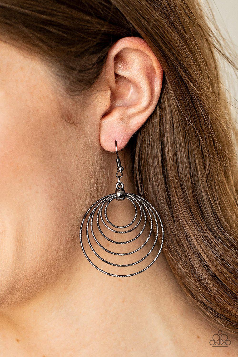 Elliptical Elegance Black Earrings - Paparazzi Accessories- on model - CarasShop.com - Paparazzi Jewelry by Cara Jewels