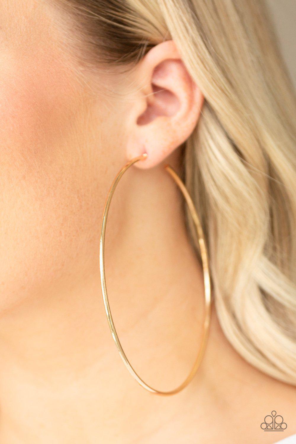 Extra Extra Gold Hoop Earrings - Paparazzi Accessories- on model - CarasShop.com - Paparazzi Jewelry by Cara Jewels