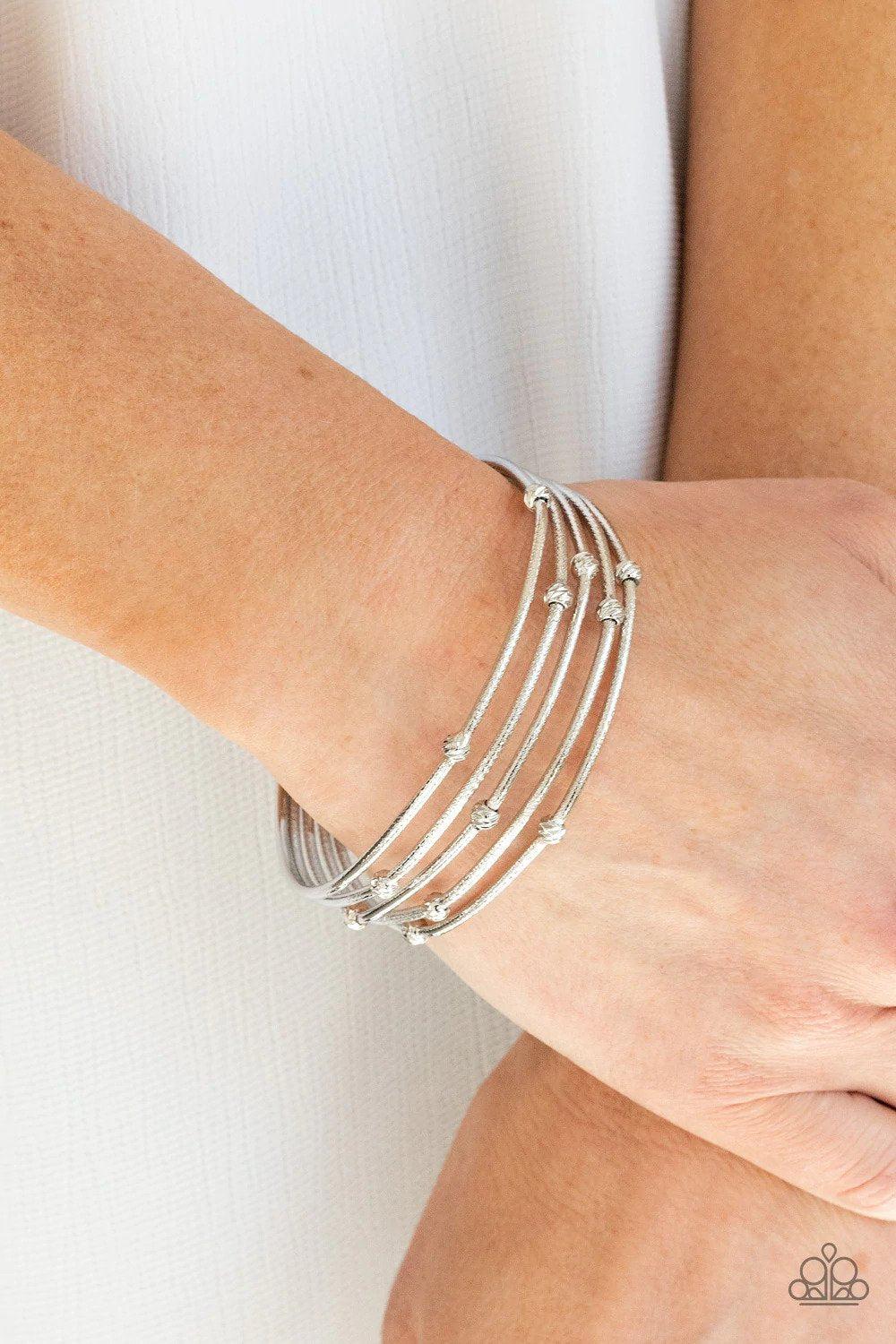 Face The METALLIC Music Silver Bracelet - Paparazzi Accessories- on model - CarasShop.com - Paparazzi Jewelry by Cara Jewels