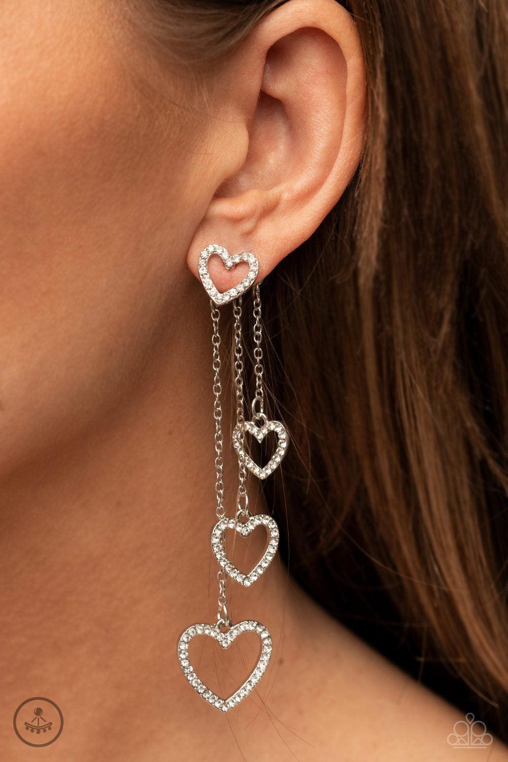 Falling In Love White Rhinestone Heart Earrings - Paparazzi Accessories- on model - CarasShop.com - Paparazzi Jewelry by Cara Jewels