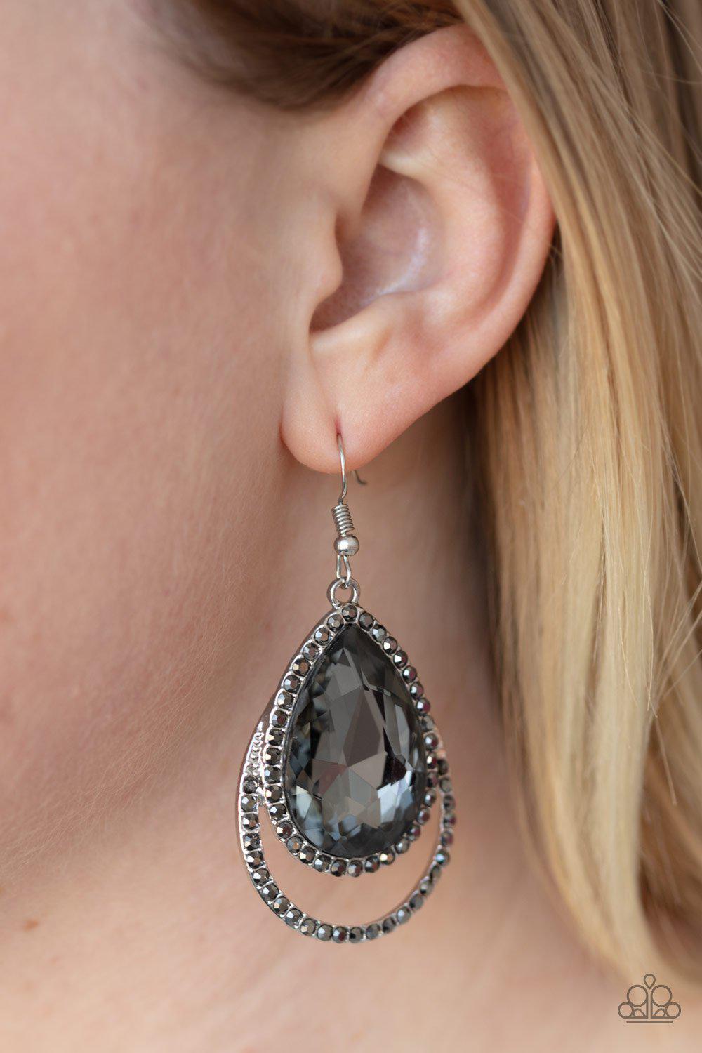 Famous Silver Rhinestone Teardrop Earrings - Paparazzi Accessories- on model - CarasShop.com - Paparazzi Jewelry by Cara Jewels