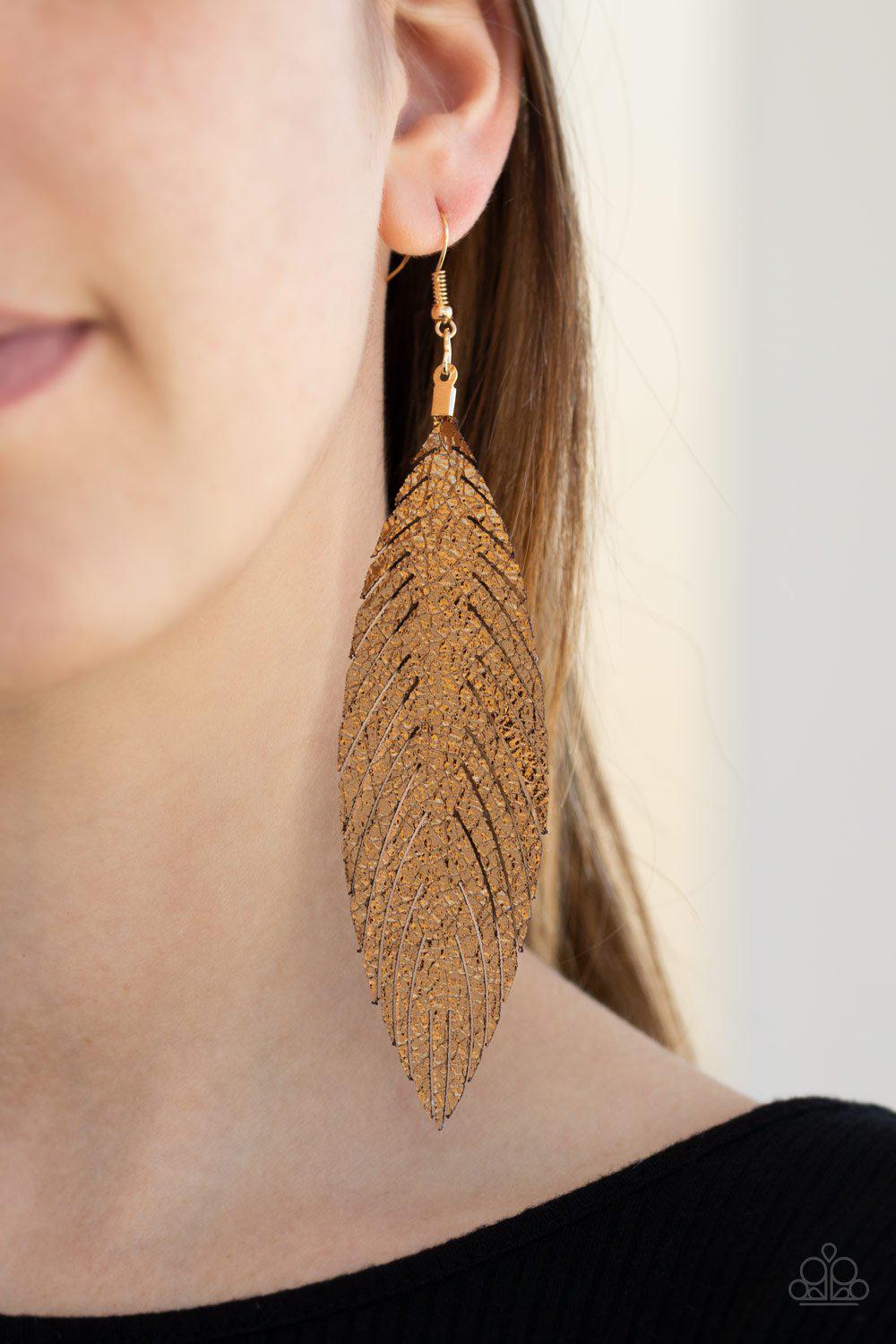 Feather Fantasy Gold Metallic Leather Feather Earrings - Paparazzi Accessories- on model - CarasShop.com - Paparazzi Jewelry by Cara Jewels