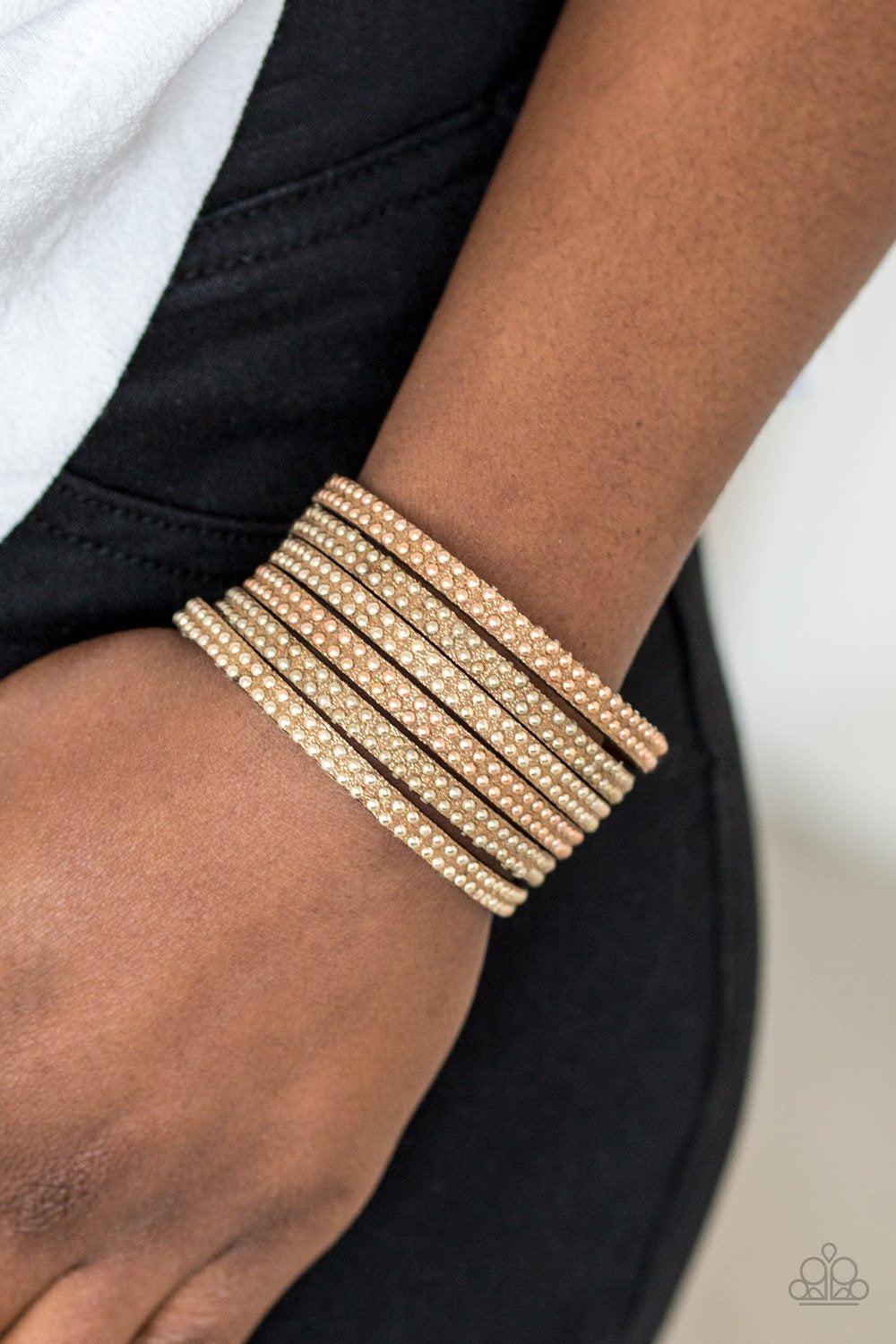 Fight Fire With Fire Brass Urban Wrap Snap Bracelet - Paparazzi Accessories- on model - CarasShop.com - Paparazzi Jewelry by Cara Jewels