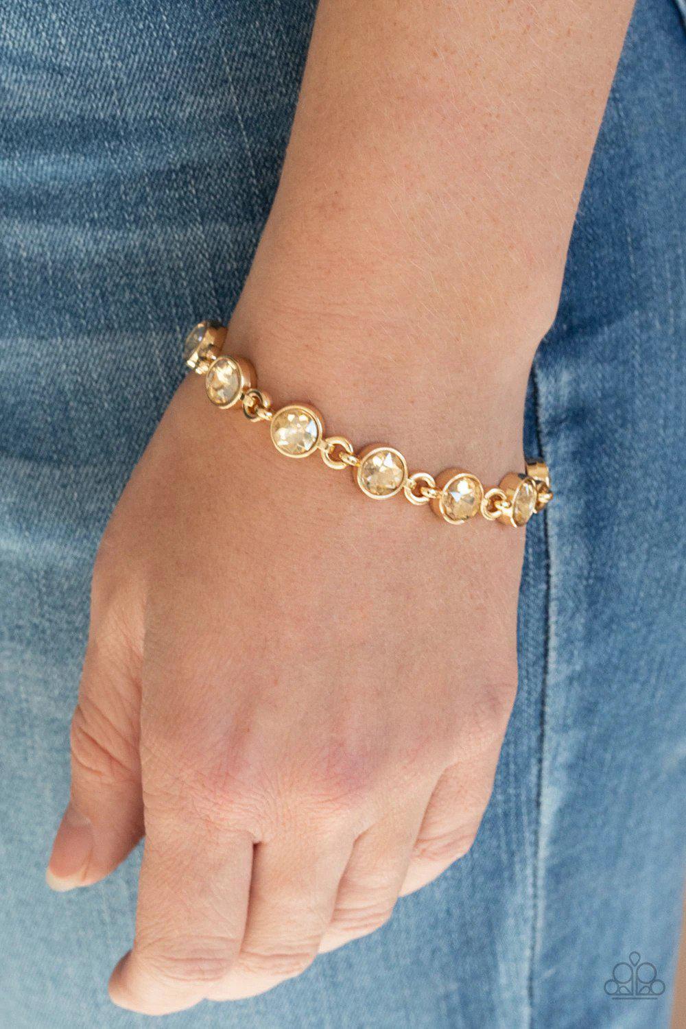 First In Fashion Show Gold Bracelet - Paparazzi Accessories- on model - CarasShop.com - Paparazzi Jewelry by Cara Jewels