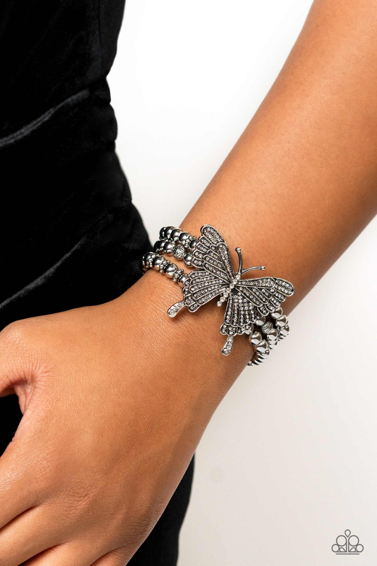First WINGS First White Rhinestone Butterfly Bracelet - Paparazzi Accessories- on model - CarasShop.com - Paparazzi Jewelry by Cara Jewels