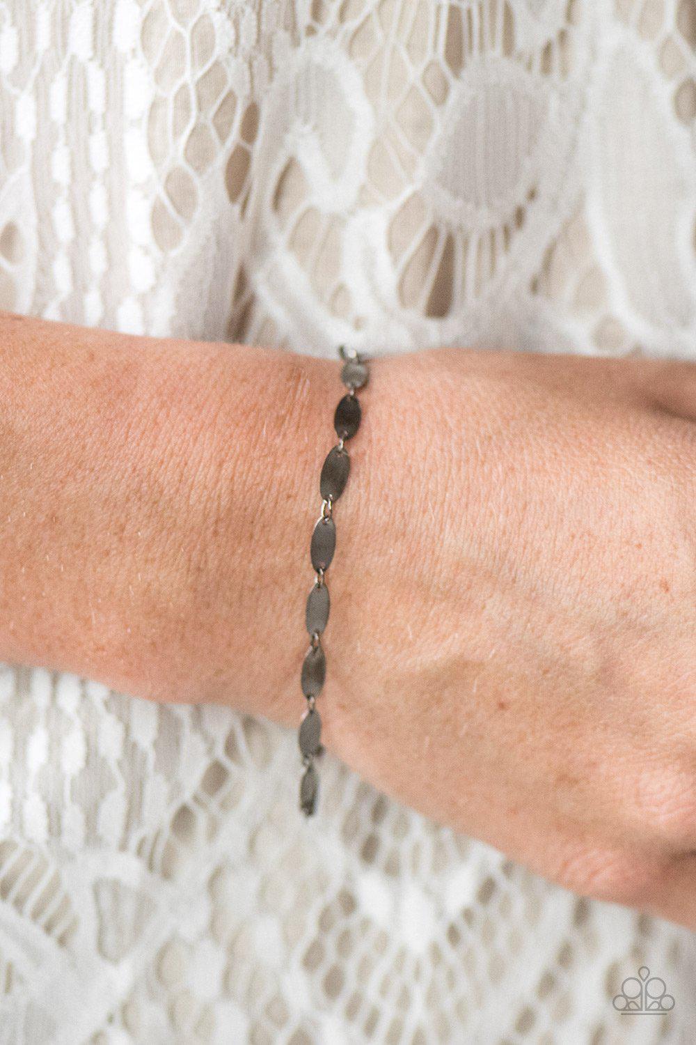 Flash Fire Gunmetal Black Bracelet - Paparazzi Accessories- on model - CarasShop.com - Paparazzi Jewelry by Cara Jewels