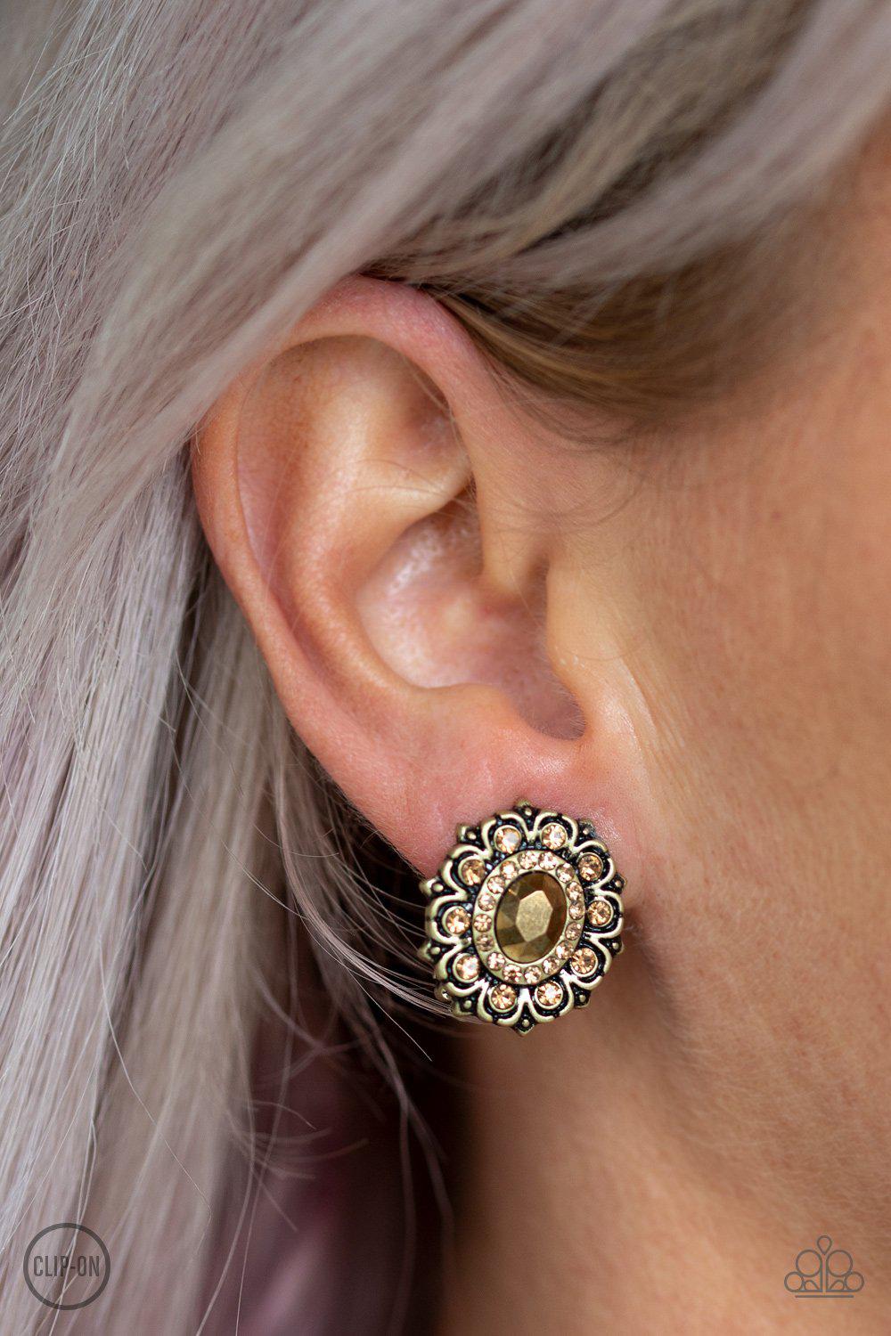 Flowering Dazzle Brass Clip-On Earrings - Paparazzi Accessories- on model - CarasShop.com - Paparazzi Jewelry by Cara Jewels