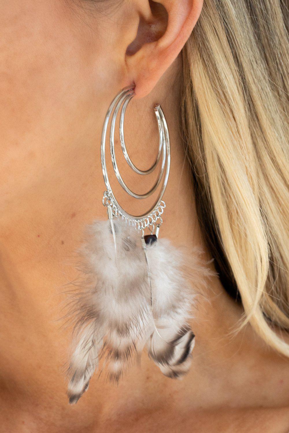 Freely Free Bird Brown Feather and Silver Hoop Earrings - Paparazzi Accessories- on model - CarasShop.com - Paparazzi Jewelry by Cara Jewels