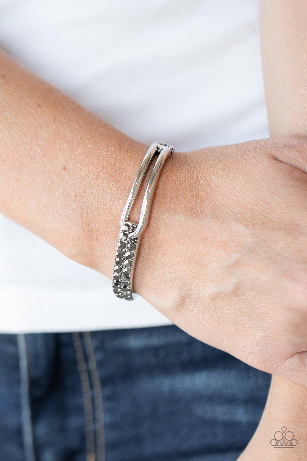 Freeze! Silver Hematite Rhinestone Hinged Bracelet - Paparazzi Accessories- on model - CarasShop.com - Paparazzi Jewelry by Cara Jewels