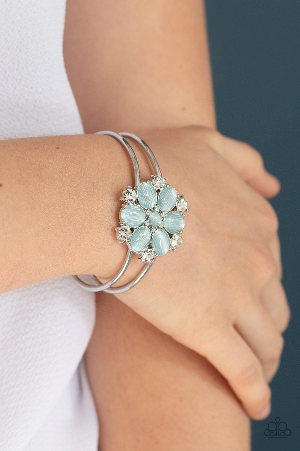 Garden Extravagance Blue Cat's Eye Flower Bracelet - Paparazzi Accessories- on model - CarasShop.com - Paparazzi Jewelry by Cara Jewels