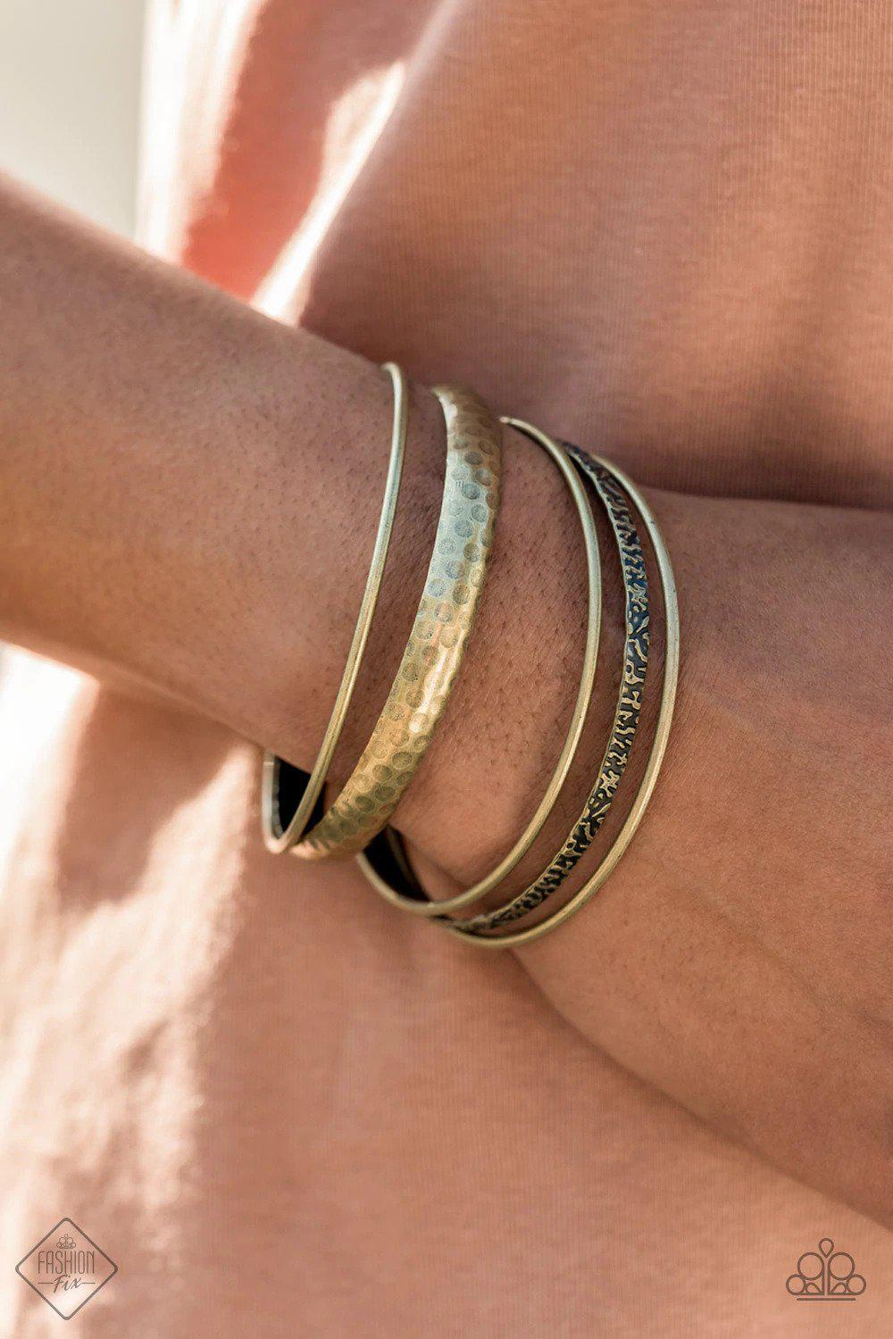 Get Into Gear Brass Bangle Bracelet - Paparazzi Accessories- on model - CarasShop.com - Paparazzi Jewelry by Cara Jewels