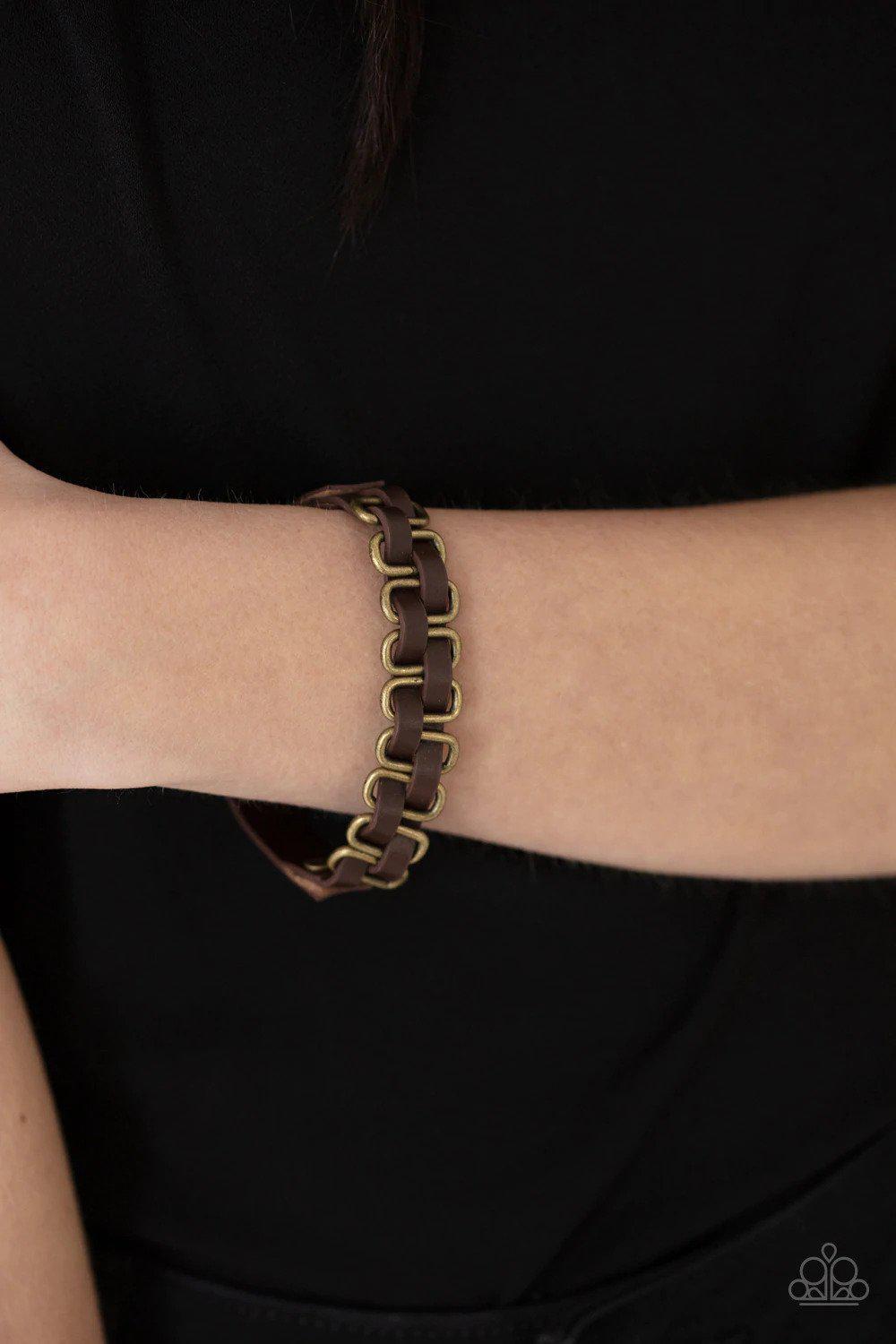 Gone Rogue Brass Bracelet - Paparazzi Accessories- on model - CarasShop.com - Paparazzi Jewelry by Cara Jewels