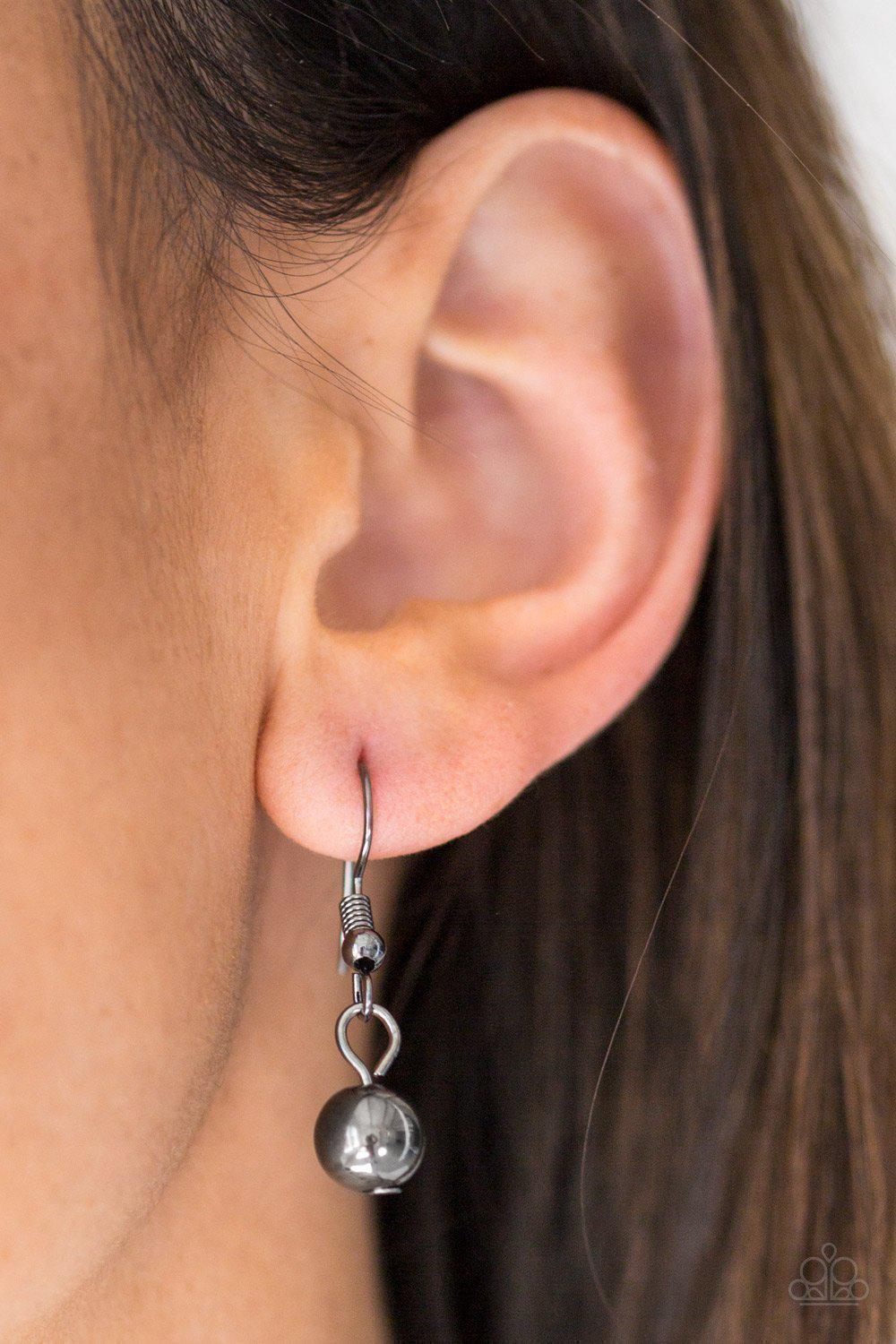 Grotto Glow Gunmetal Black Necklace - Paparazzi Accessories- on model - CarasShop.com - Paparazzi Jewelry by Cara Jewels