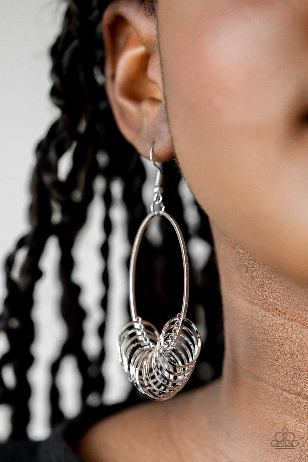 Halo Effect Silver Earrings - Paparazzi Accessories- on model - CarasShop.com - Paparazzi Jewelry by Cara Jewels