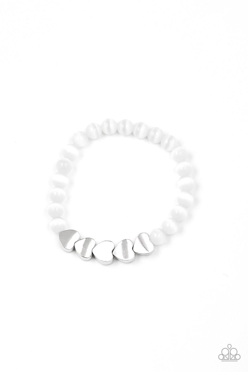 Heart-Melting Glow White Cat's Eye Heart Bracelet - Paparazzi Accessories- on model - CarasShop.com - Paparazzi Jewelry by Cara Jewels