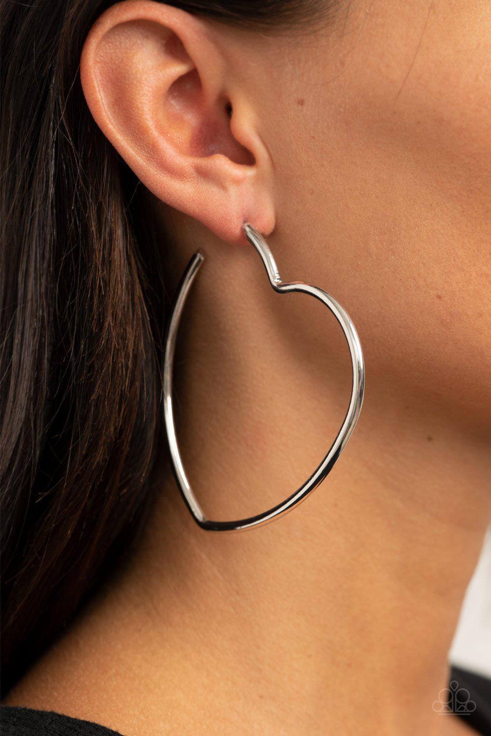 Heartbreaker Hustle Silver Heart-shaped Hoop Earrings - Paparazzi Accessories- lightbox - CarasShop.com - Paparazzi Jewelry by Cara Jewels
