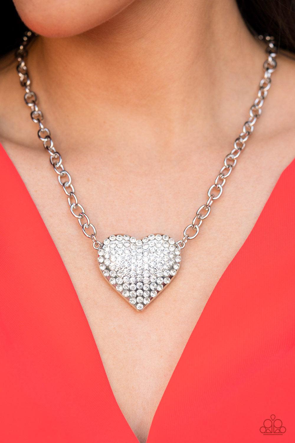 Heartbreakingly Blingy White Rhinestone Heart Necklace - Paparazzi Accessories- on model - CarasShop.com - Paparazzi Jewelry by Cara Jewels