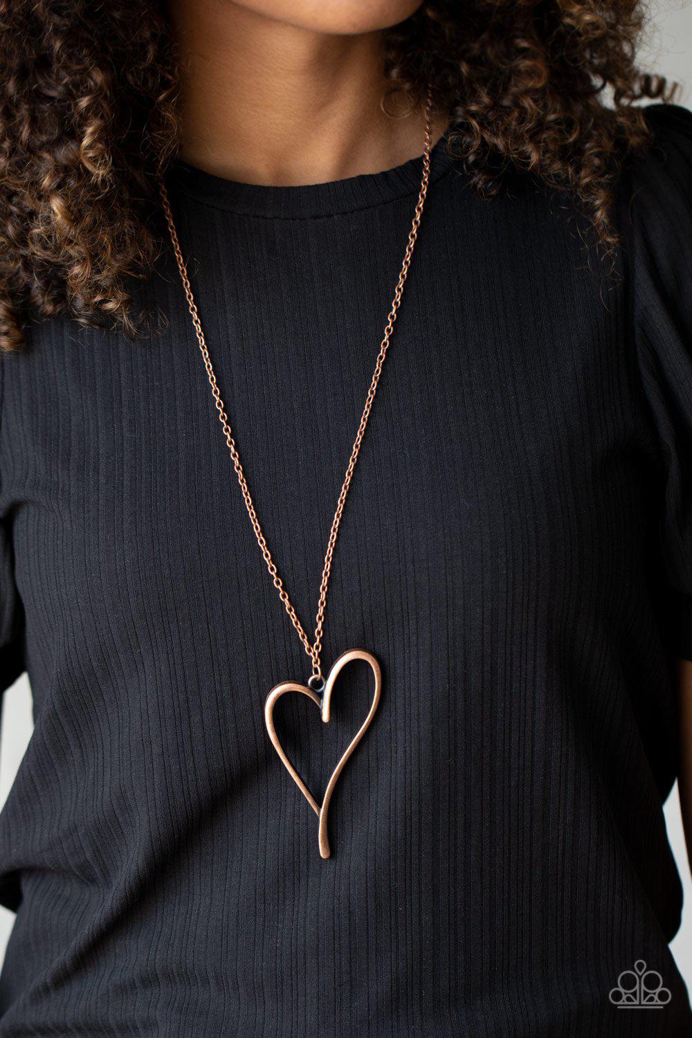 HEARTS So Good Long Copper Heart Necklace - Paparazzi Accessories- on model - CarasShop.com - Paparazzi Jewelry by Cara Jewels