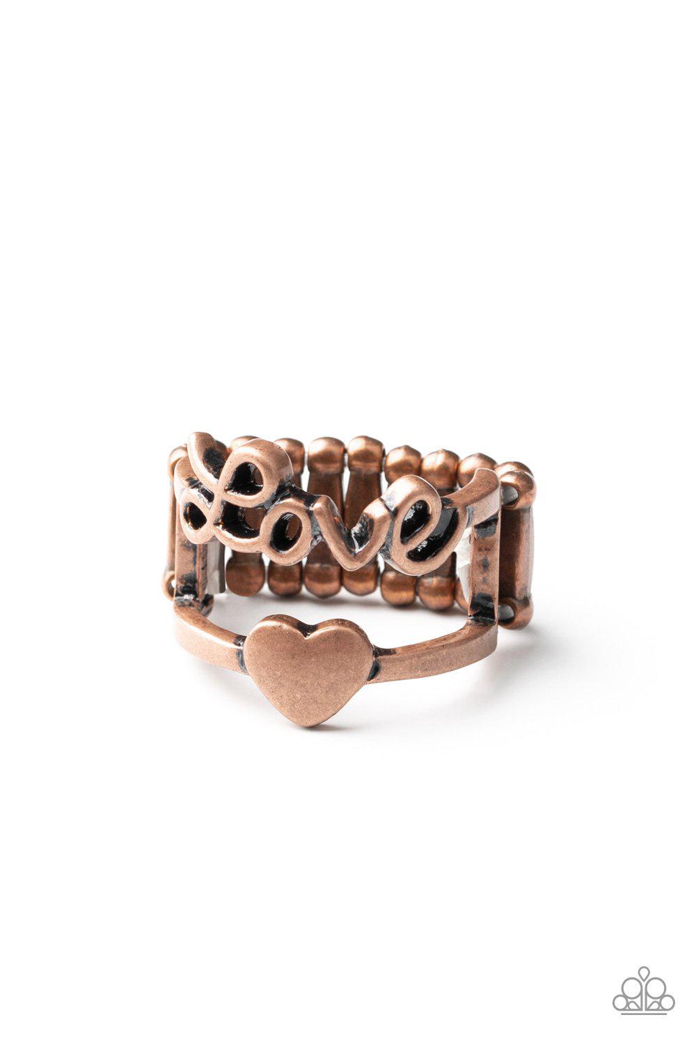 Heartstring Harmony Copper "Love" Ring - Paparazzi Accessories- on model - CarasShop.com - Paparazzi Jewelry by Cara Jewels