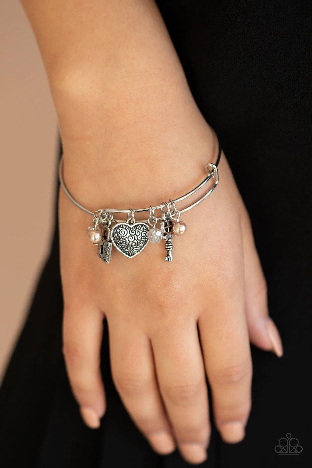 Here Comes Cupid Brown Charm Bracelet - Paparazzi Accessories- on model - CarasShop.com - Paparazzi Jewelry by Cara Jewels